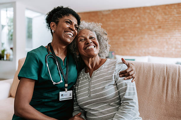 home care healthcare professional hugging elderly patien